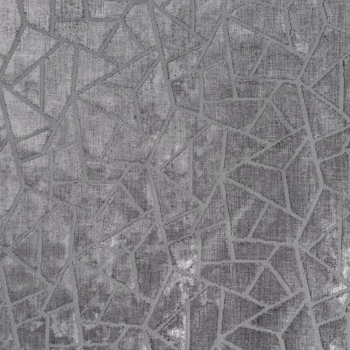 Cool aluminium grey textile with fractured geometric lines and a softly textured woven surface