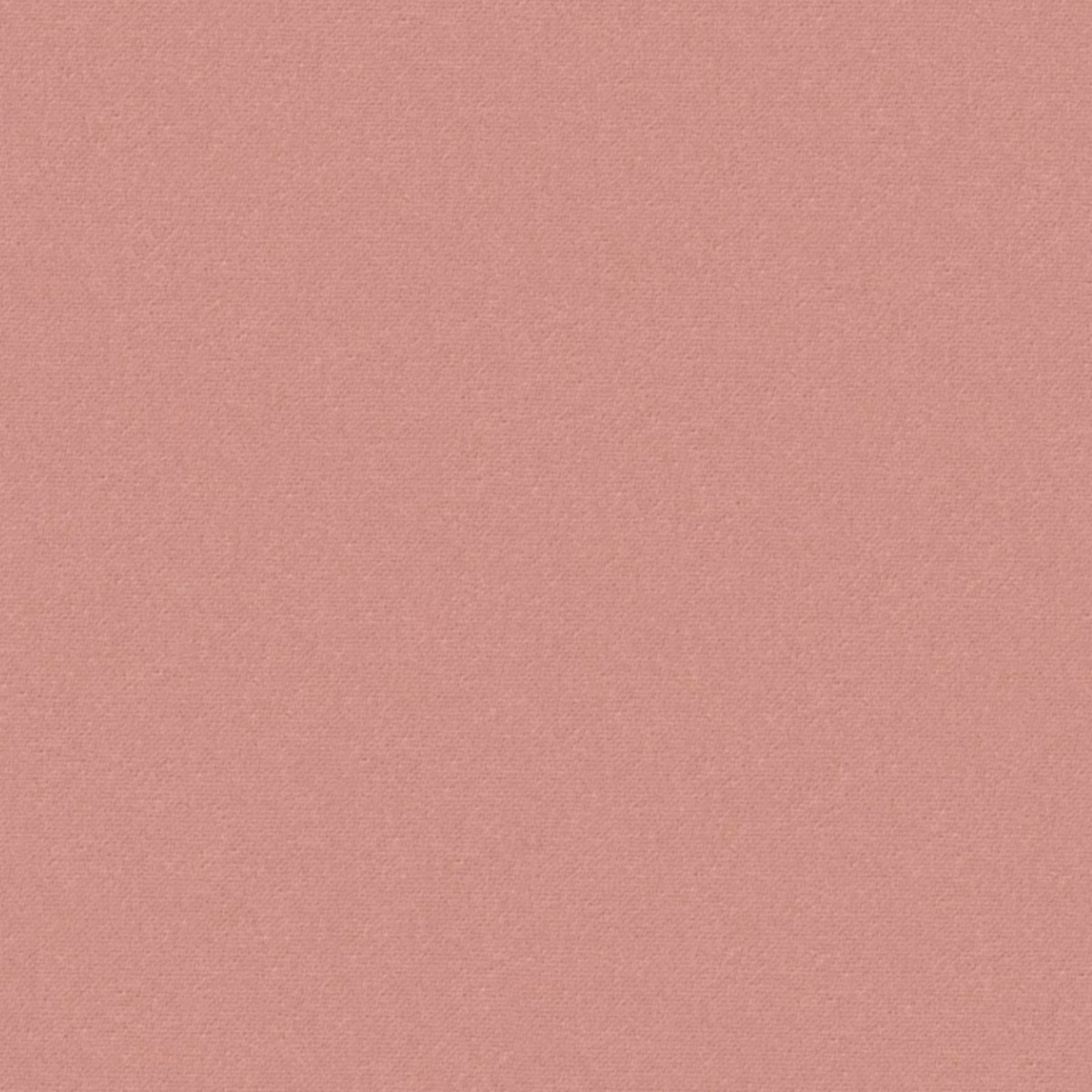 Close-up of plain dusty rose-pink fabric with a fine woven texture