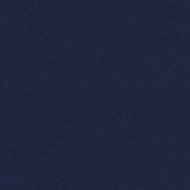 Close view of deep denim-blue fabric with a fine, subtly textured plain weave