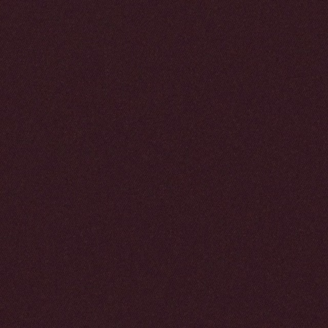 Close-up of deep blackberry plum fabric with a fine, subtly diagonal woven texture