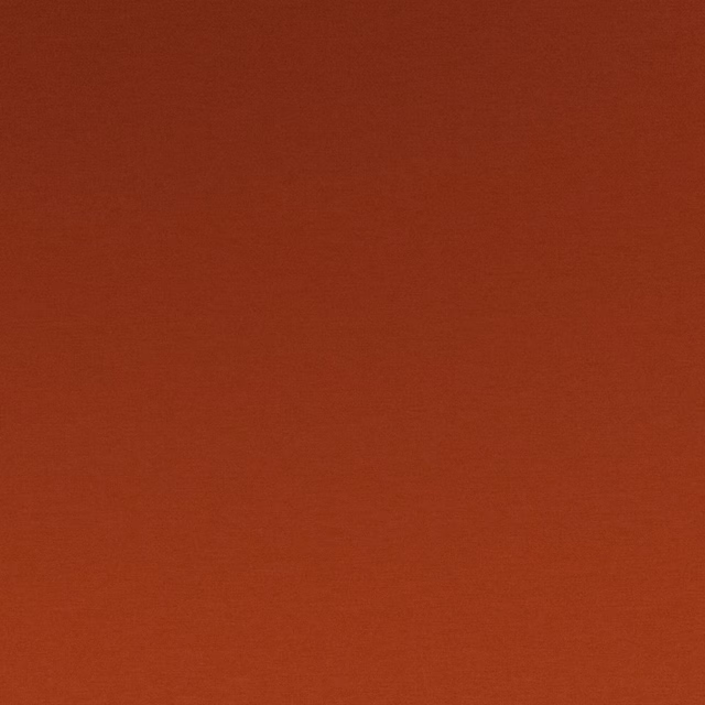 Warm paprika-red fabric with a fine, subtly textured matte weave
