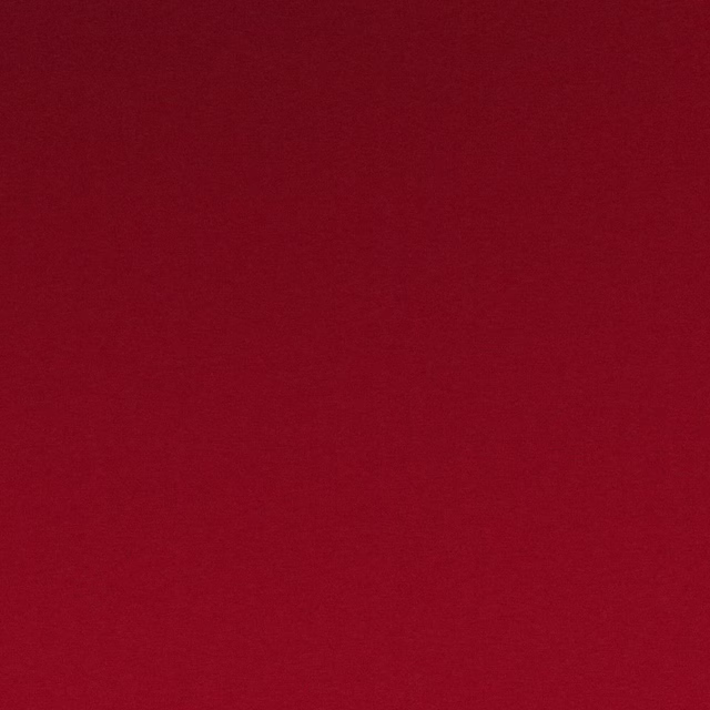 Deep scarlet red textile with a subtle, even woven surface