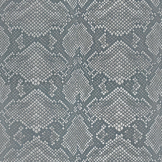 Close-up of muted blue-grey woven fabric with repeating diamond geometric pattern