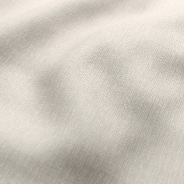 Pale oat-beige fabric with a fine softly irregular woven texture