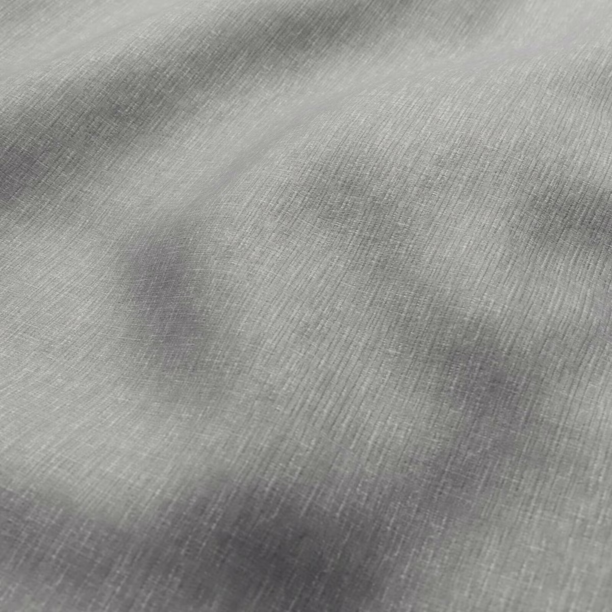 Close-up of cool steel grey fabric with fine striated weave and smoky tonal shading