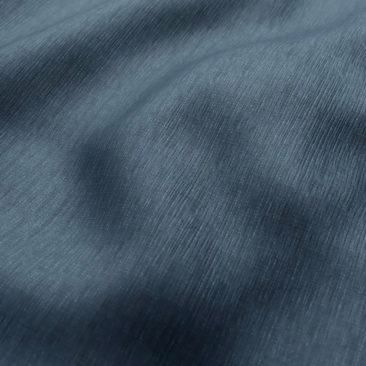 Deep Atlantic blue-grey fabric with fine directional ribbing and softly lustrous folds