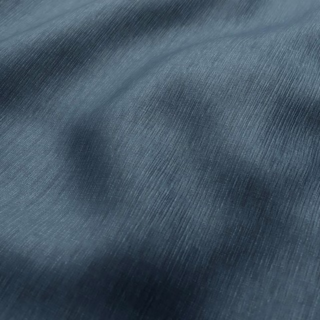 Deep Atlantic blue-grey fabric with fine directional ribbing and softly lustrous folds