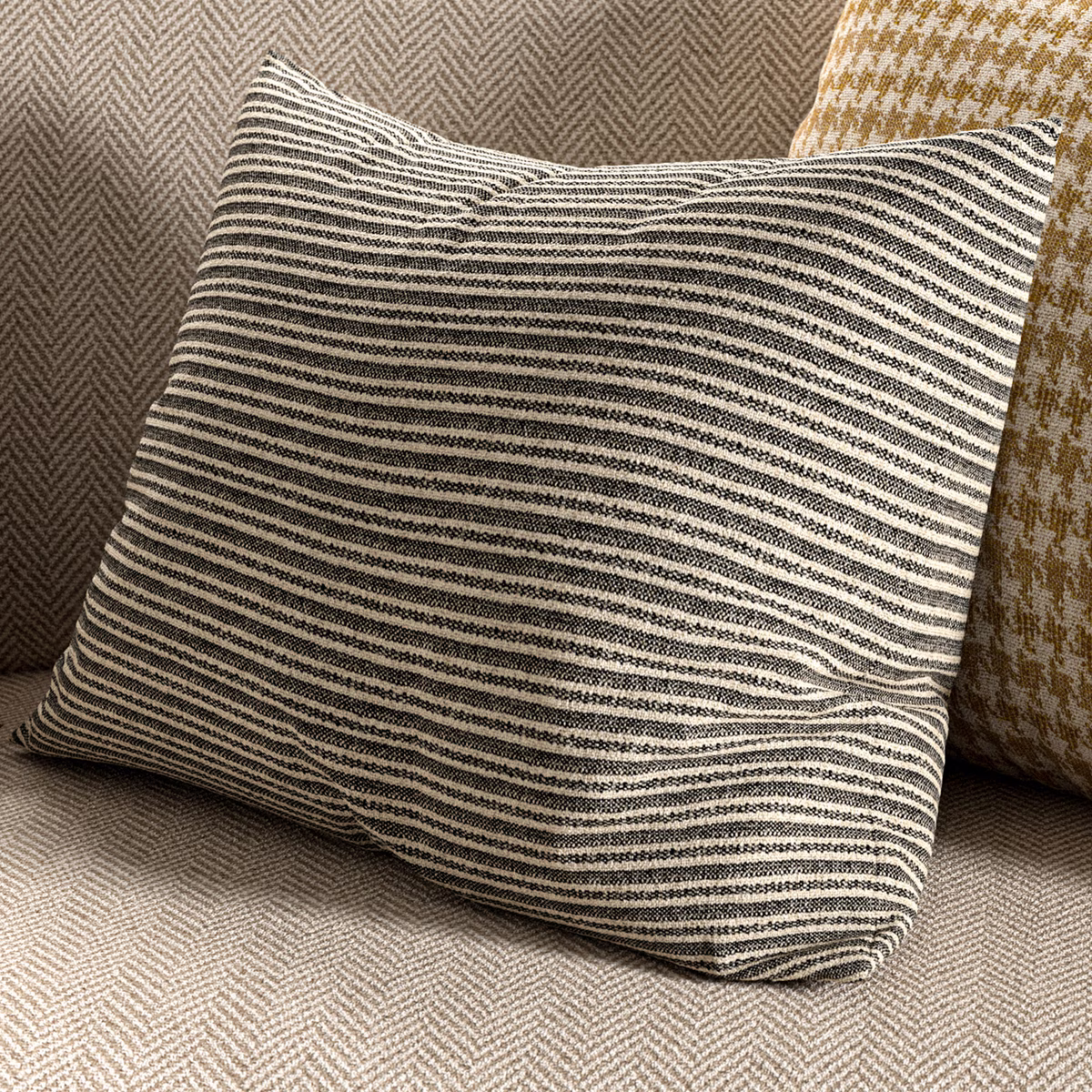 Cool taupe-grey woven fabric with irregular charcoal and ivory horizontal stripes