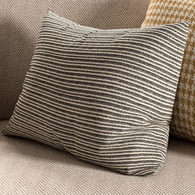Cool taupe-grey woven fabric with irregular charcoal and ivory horizontal stripes