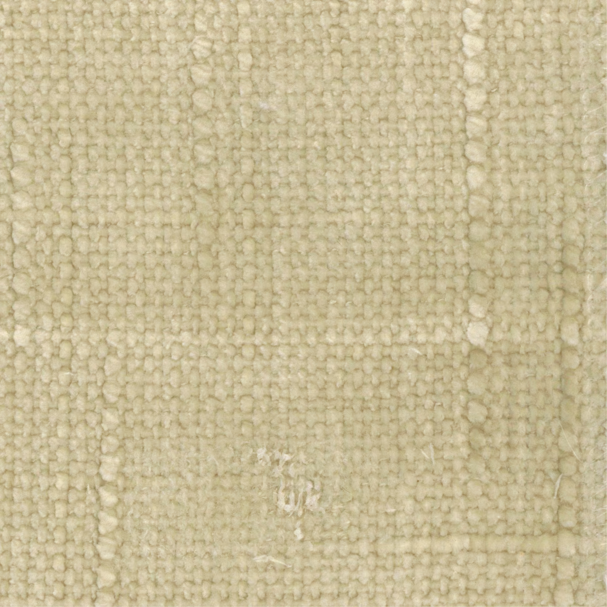 Close-up of pale limestone fabric showing chunky loops and subtle vertical tonal variation