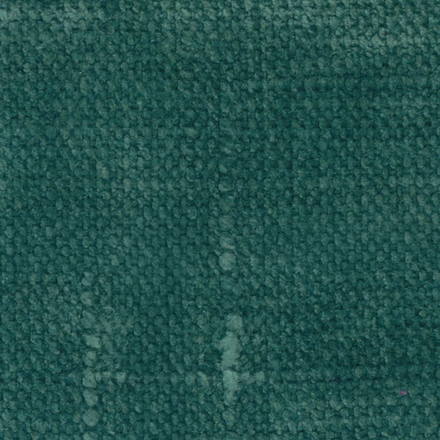 Close-up of deep peacock teal fabric with dense nubby looped texture and tonal flecks