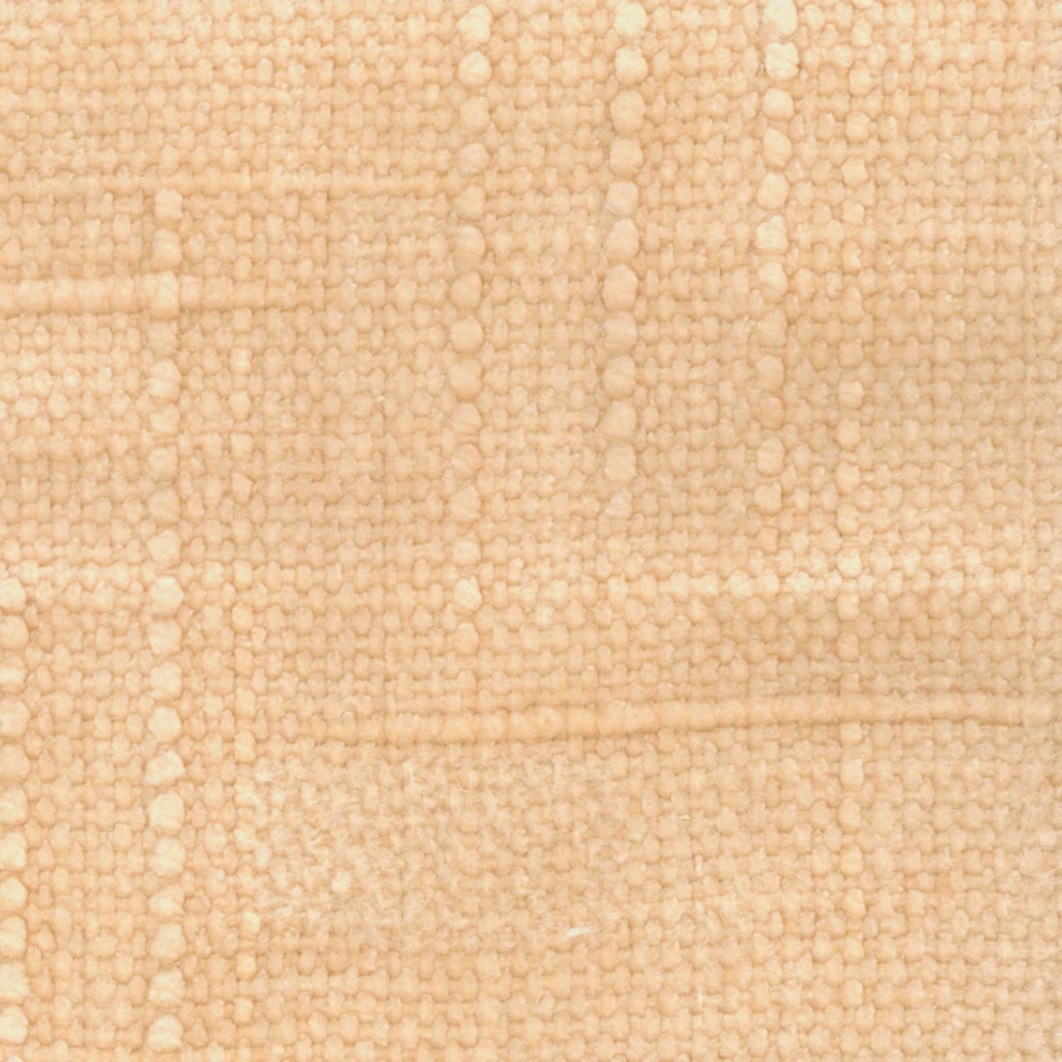 Warm pale peach fabric with chunky irregular loops and softly mottled woven texture