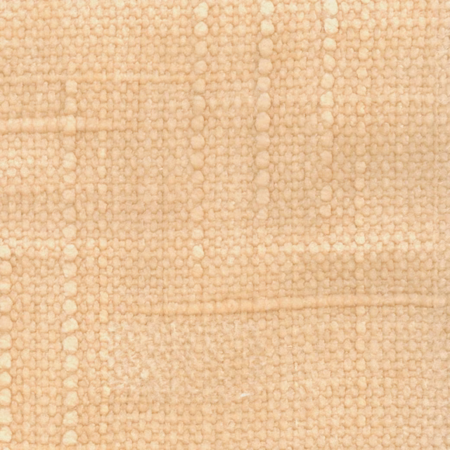 Warm pale peach fabric with chunky irregular loops and softly mottled woven texture