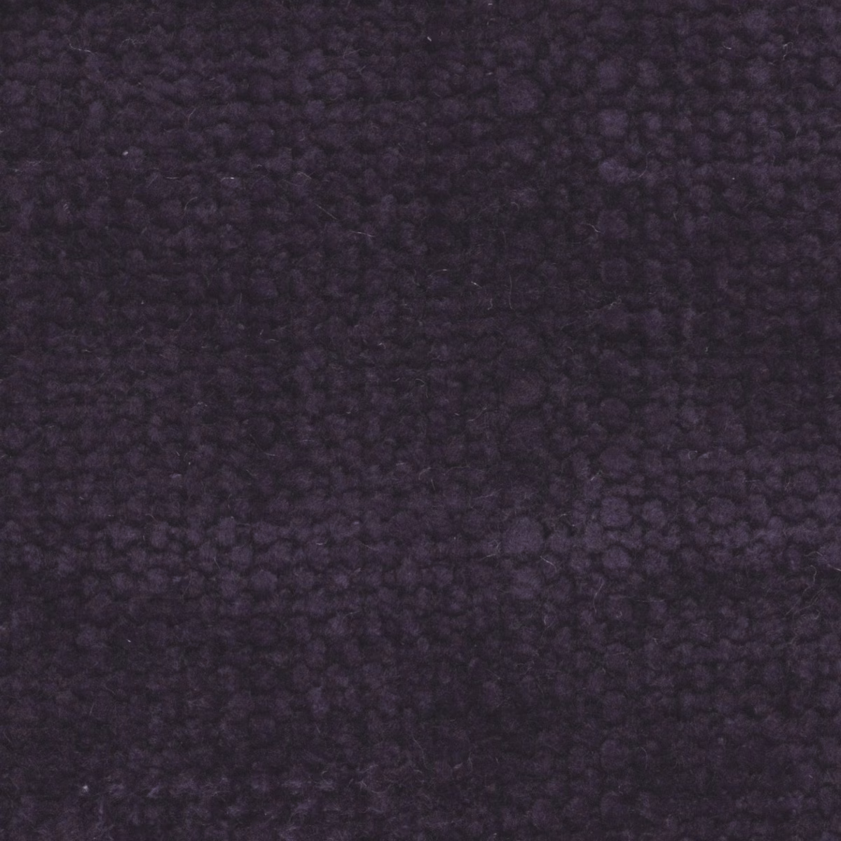 Deep iris-purple fabric with dense, irregular nubbled texture and softly shadowed surface