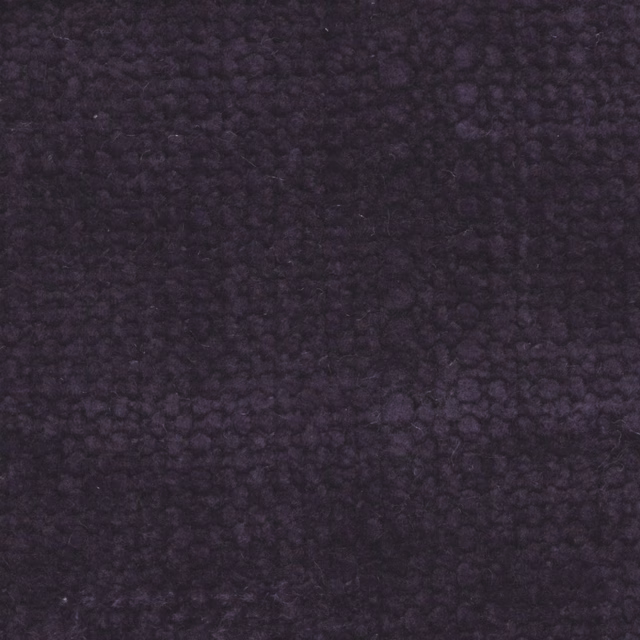 Deep iris-purple fabric with dense, irregular nubbled texture and softly shadowed surface