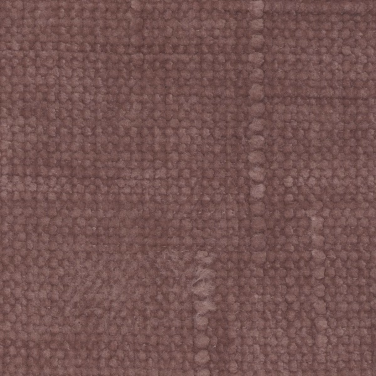 Close-up of muted mauve-heather fabric with a chunky, irregular looped weave