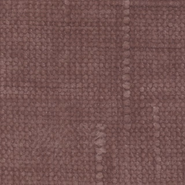 Close-up of muted mauve-heather fabric with a chunky, irregular looped weave