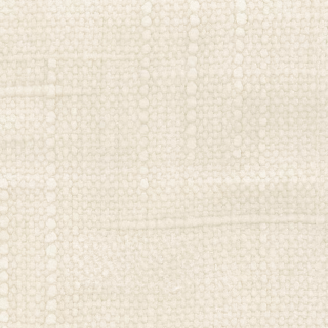 Close-up of pale marshmallow cream fabric with a softly irregular looped weave