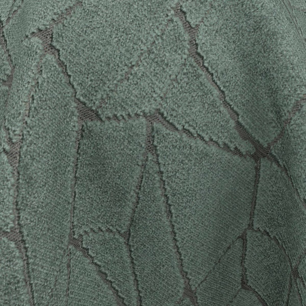 Close-up of deep jade fabric with dark angular lines and nubby texture
