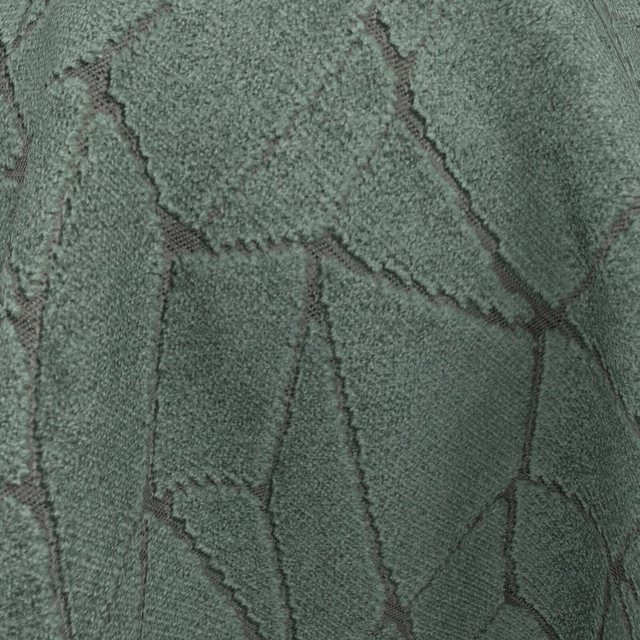 Close-up of deep jade fabric with dark angular lines and nubby texture