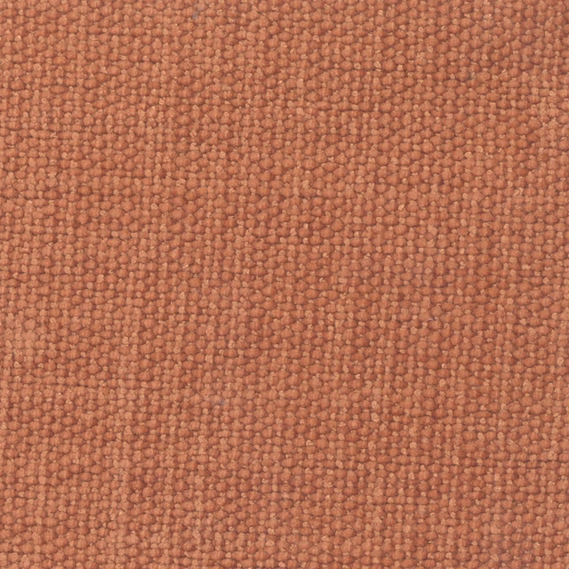 Warm spice terracotta fabric showing a dense, nubby woven texture