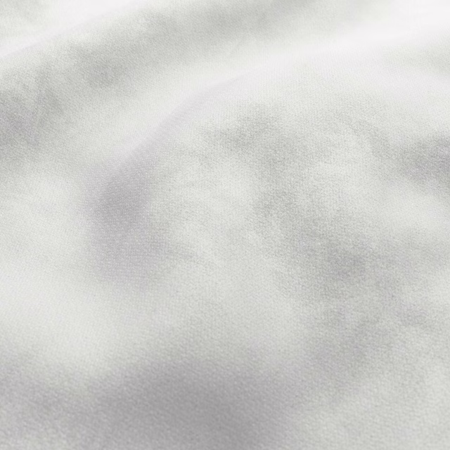 Snow white fabric with soft pale-grey clouding and a fine woven texture