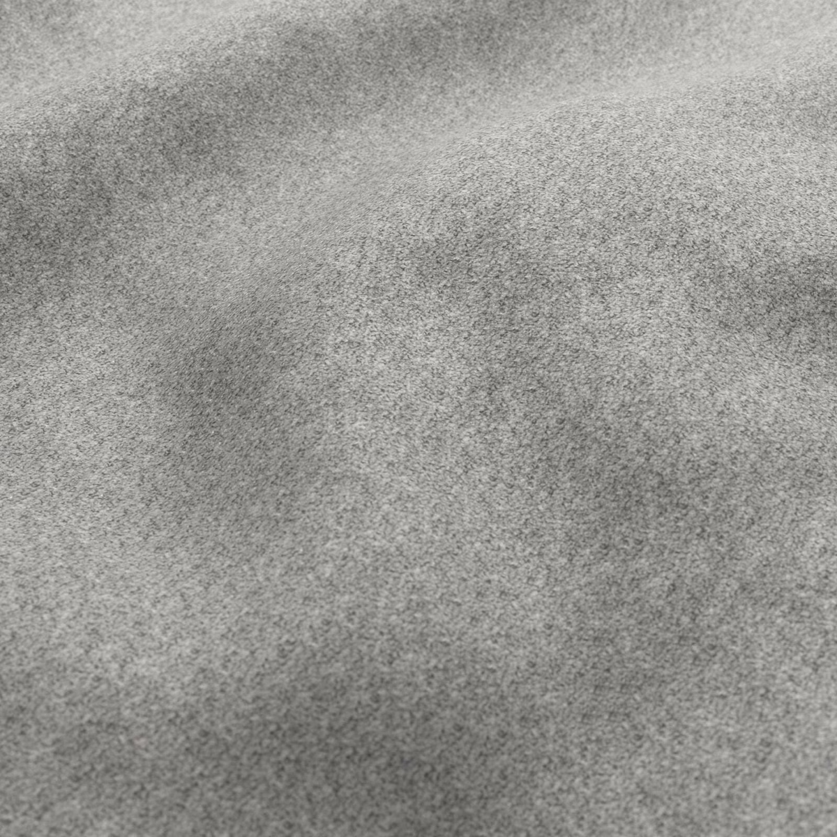 Close-up of cool wolf grey fabric with a dense, softly mottled tactile surface