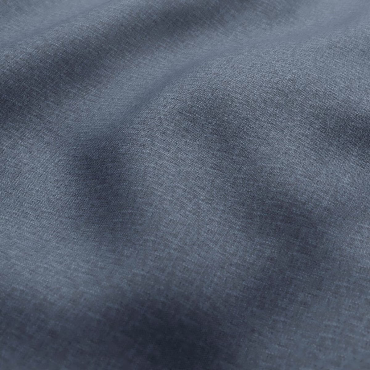 Close-up of cool slate-blue woven fabric with fine crosshatch texture and tonal shading