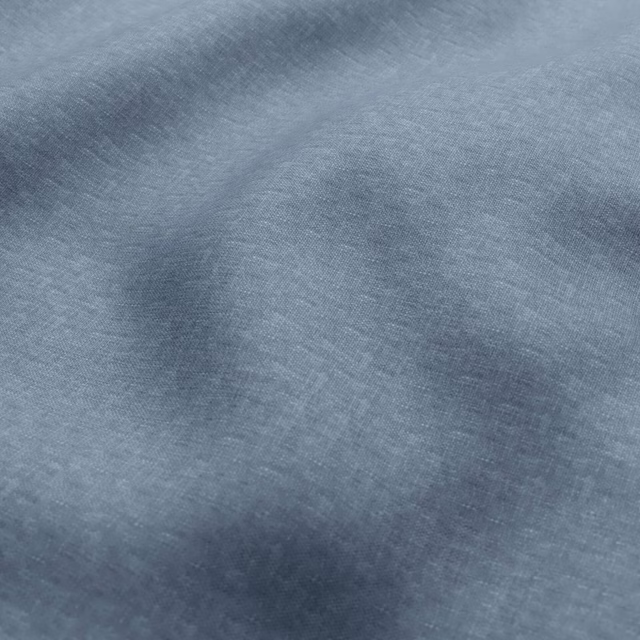 Close-up of blue-grey woven fabric with soft slate-toned cloudy variation