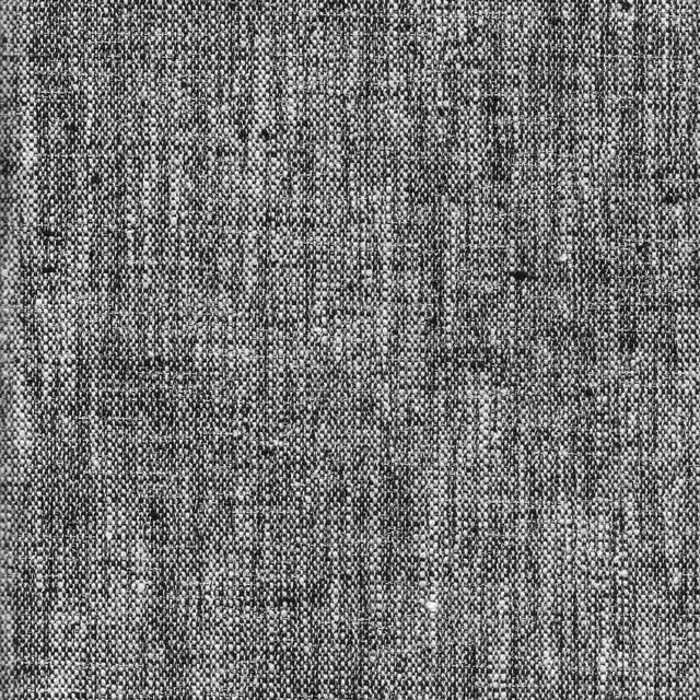 Close-up of charcoal and black woven fabric with pale grey flecks and irregular vertical texture
