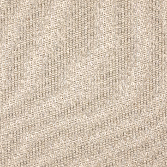 Close-up of warm oat-beige woven fabric with fine vertical ribs and subtle tonal flecks