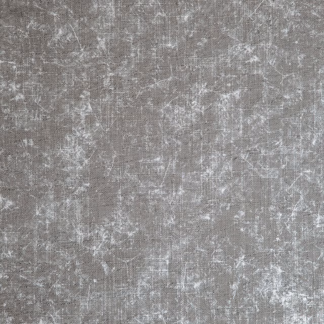 Weathered taupe-grey woven textile with pale abstract crosshatch marks and fine texture