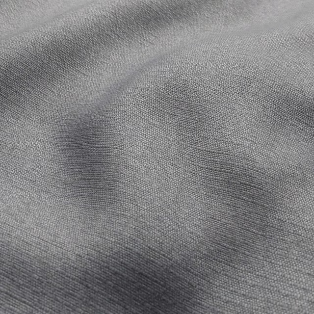 Cool grey Shetland textile with fine woven grain and soft shadowed ripples