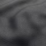 Deep charcoal-grey close weave with graphite highlights across folded textile