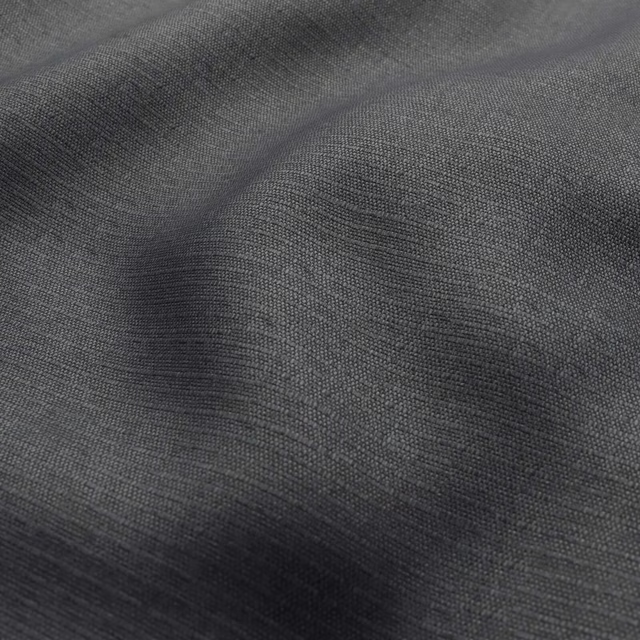 Deep charcoal-grey close weave with graphite highlights across folded textile