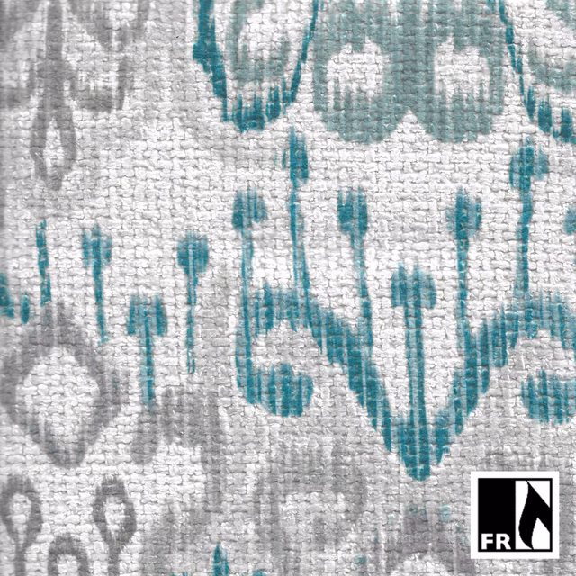 Textured silver-grey fabric with muted teal ikat-like floral motifs and charcoal accents