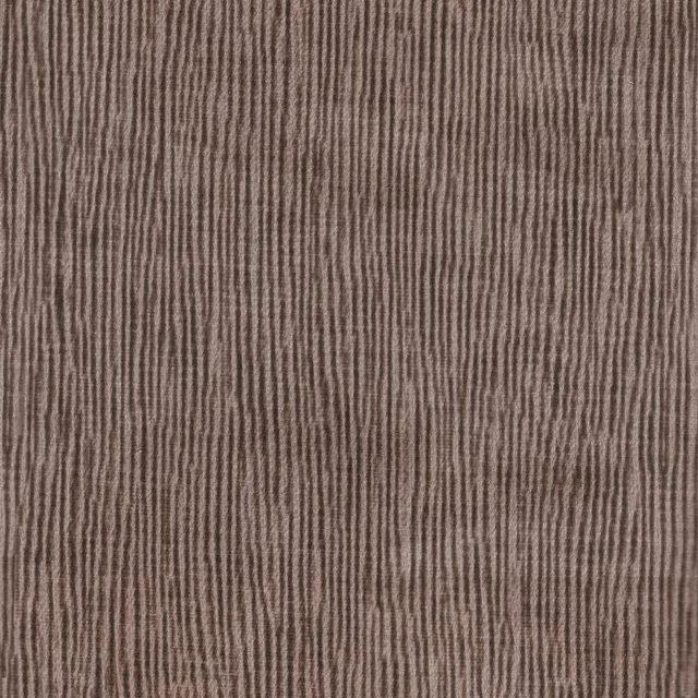 Muted blush-taupe textile with irregular vertical striations and a softly ribbed surface