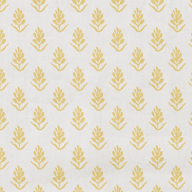 Ivory woven fabric with repeating small golden-yellow botanical sprigs