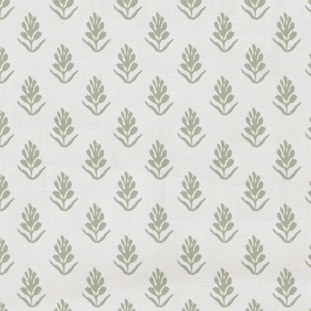 Cream fabric with repeating muted sage leafy sprigs and a fine woven texture