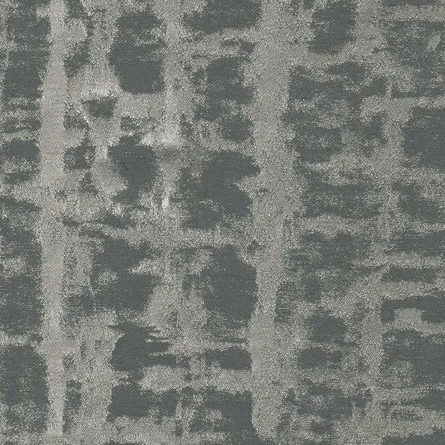 Close view of cool ash-grey woven fabric with irregular charcoal-grey blocks