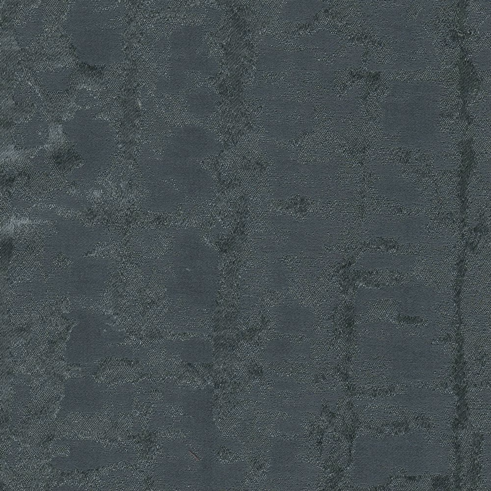 Deep indigo-blue textile with cloudy charcoal mottling and a finely tactile weave