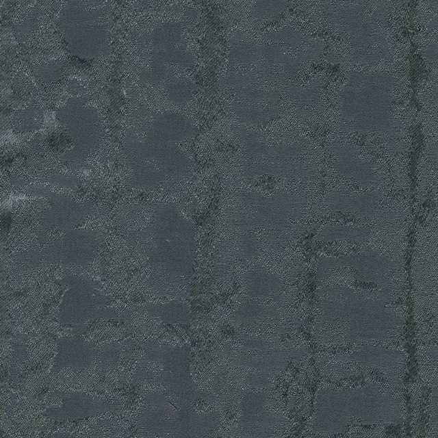 Deep indigo-blue textile with cloudy charcoal mottling and a finely tactile weave