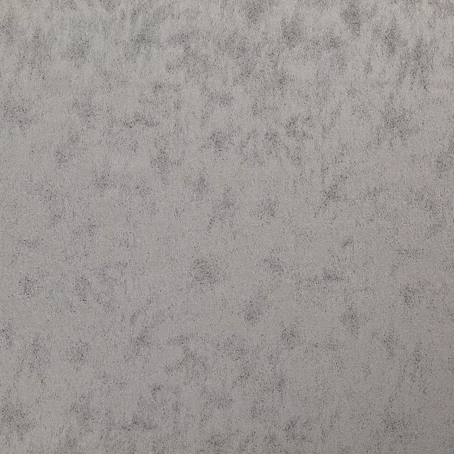 Close-up of cool platinum-grey fabric with softly mottled, cloudy texture