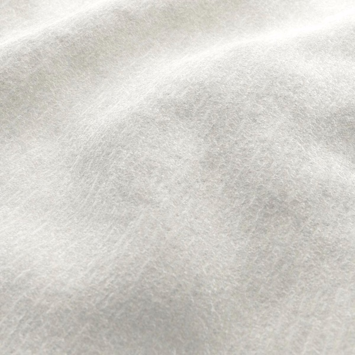 Pale ice-grey teddy fabric with soft cloudy shading and a lightly brushed nap