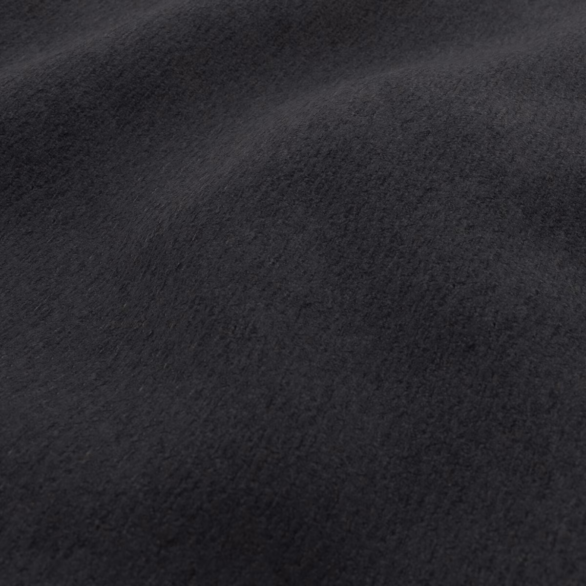 Close-up of deep black Teddy fabric showing a soft, brushed pile