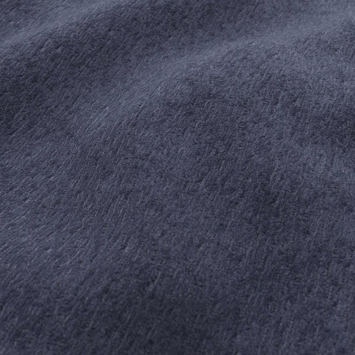 Deep midnight blue plush fabric showing a softly brushed, tonal surface
