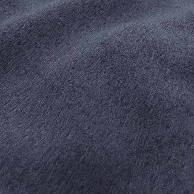 Deep midnight blue plush fabric showing a softly brushed, tonal surface