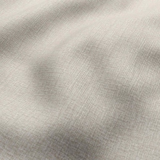 Pale warm greige fabric with fine crosswoven texture and softly shaded folds