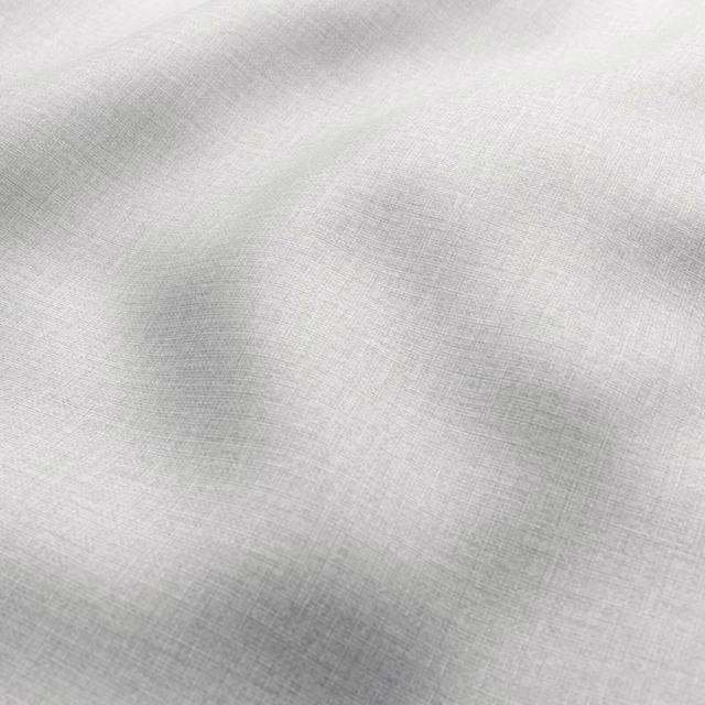 Pale cool-grey woven textile with soft cloudy shading and fine crosshatch texture