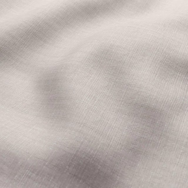 Pale latte beige fabric with fine vertical ribbing and cloudy taupe shading